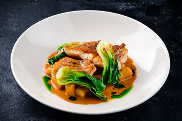 Snapper fish steak in white plate