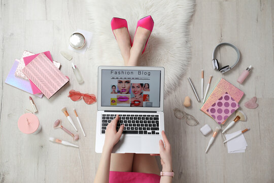 Fashion blogger with laptop on floor, top view