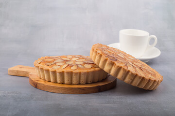 almond homemade two tart on gary background.