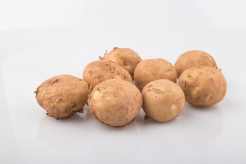 fresh potatoes isolated on a white background.
