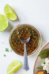 Mustard, olive oil and dill salad dressing in glass jar. Cooking healthy food concept.