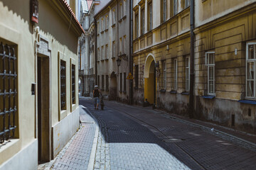 man with bicycle at the old streets of Warsaw