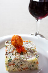the famous salad in the favorite restaurant of Stalin, the leader of the USSR-Gagripsh, Abkhazia. Salad of vegetables, capers, meat with white sauce and red caviar.