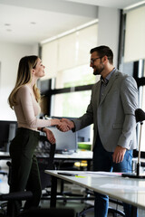 Businesswoman offering hand for handshake. Businessman and businesswoman handshake..