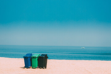 Three Colorful Plastic Waste Containers On Wheels For Separate Collection Of Garbage. Containers...