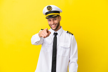 Airplane caucasian pilot isolated on yellow background points finger at you with a confident expression