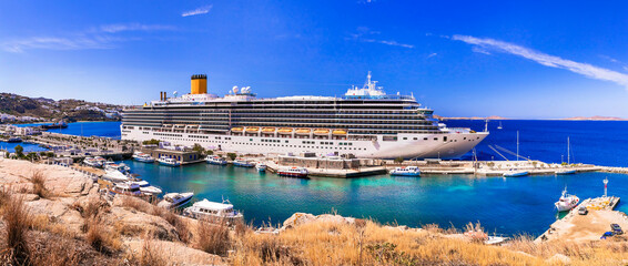 Cruise ship in port of Mykonos island. Greece travel. Mediterranean summer holidays