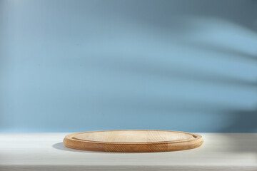 Wooden kitchen board of free space and wall with shadow 