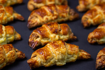 Walnut rolls on a black background. Homemade baking. Food background