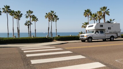 Motorhome trailer or caravan for road trip. Waterfront tropical palm trees and pacific ocean beach,...