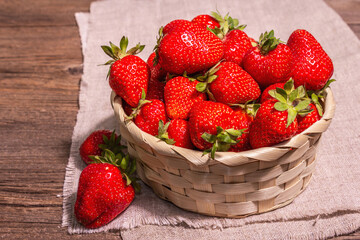 Fresh ripe strawberry in a wicker basket