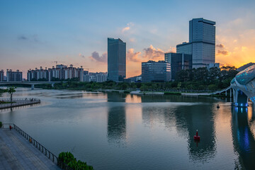 Fototapeta na wymiar Architectural scenery on the bank of the Jiaomen River in Nansha District, Guangzhou