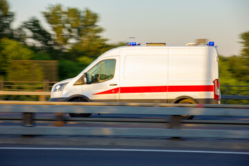 An ambulance rushes to the aid of a patient

Photo taken on the bridge in the Otradnoye district, Moscow, in the summer of 2021, car, sky, traffic.