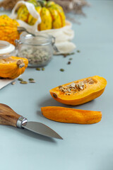 Zero waste healthy food pumpkin, seeds, vegetables, dried fruits close up on blue background. Groceries in textile bags,glass jars. Eco friendly plastic free low waste lifestyle.