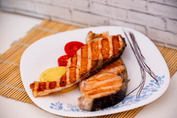 grilled fish with vegetables on a plate