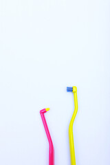 Brushes for cleaning braces. Assorted toothbrushes. Oral hygiene. Copy space. View from above. Vertical photo.