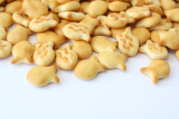 Pile of fish-shaped cookies. Baking as a background.