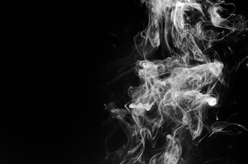 abstract fragment movement of white smoke on black background.