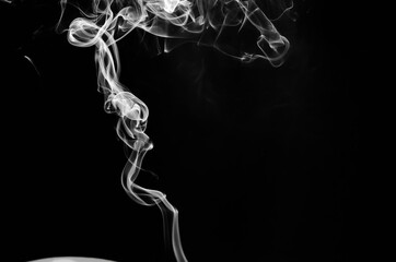 abstract fragment movement of white smoke on black background.
