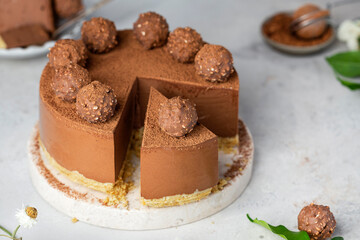 Cold chocolate cheesecake with truffle and cocoa powder