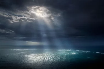 Tapeten Sunbeams and dramatic clouds. Cape Reinga Northland New Zealand. Ocean. Coast, Dark clouds. Tasman Sea. Pacific Ocean. © A