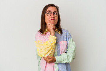 Middle age caucasian woman isolated on white background thinking and looking up, being reflective, contemplating, having a fantasy.