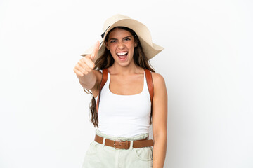Obraz na płótnie Canvas Young caucasian woman wearing a Pamela in summer holidays isolated on white background with thumbs up because something good has happened