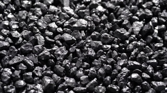 Stone ore close-up. Black stones grunge background.
