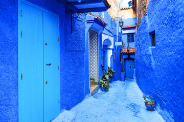 Courtyard with blue walls of houses in old medina of Chefchaouen. Morocco, North Africa