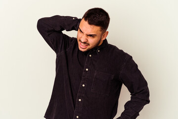 Young caucasian man isolated on white background tired and very sleepy keeping hand on head.
