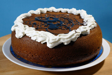 Delicious strawberry cake with cream and chocolate, tart with fresh strawberries on wooden...