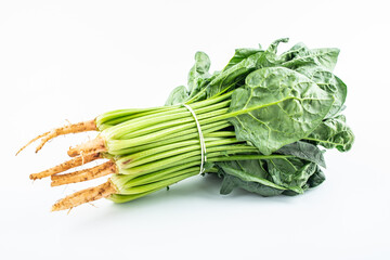 Handful of fresh spinach on white background