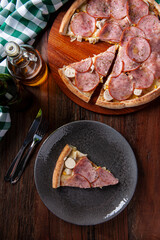 .Brazilian-style sirloin pizza with mozzarella, hearts of palm and corn. Top view. Copy space