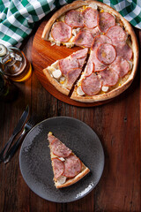 .Brazilian-style sirloin pizza with mozzarella, hearts of palm and corn. Top view. Copy space