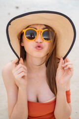 
Portrait of a 20-30 year old woman walking traveling and play marine sports on a beach by the sea in Thailand.