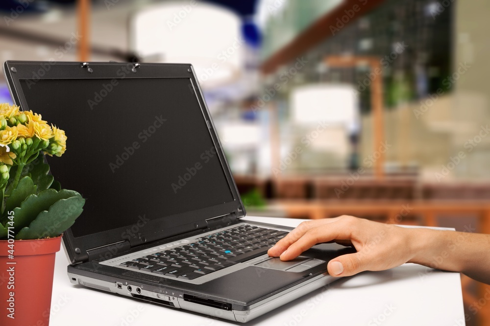 Poster empty computer screen blank mockup on a laptop with hands of the worker