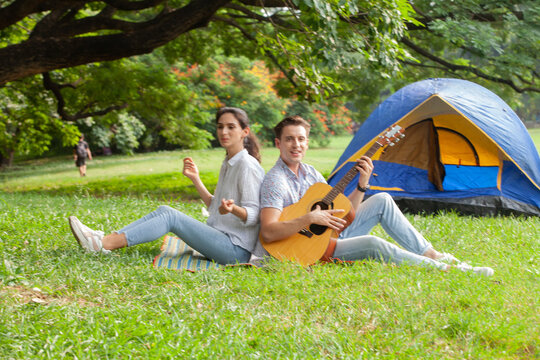 Sweet couple relaxing on picnic in park, beautiful lover spending time together and having romantic moment
 - Powered by Adobe