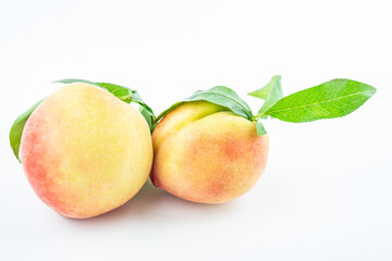 Fresh peaches on white background