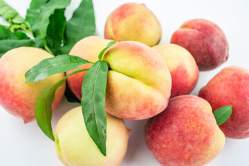 Fresh peaches on white background