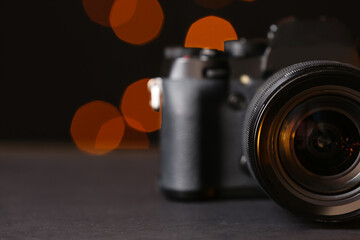 Digital camera on blurred background, closeup