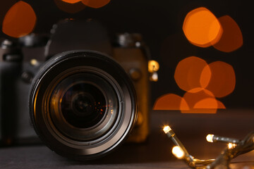 Fototapeta na wymiar Digital camera on blurred background, closeup