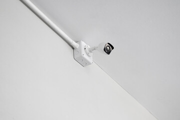 cctv security camera on white wall