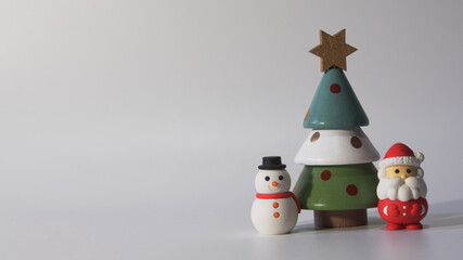 Santa Claus, snowman, Christmas tree decorations on the right side of the image on a white background, with space to insert text.