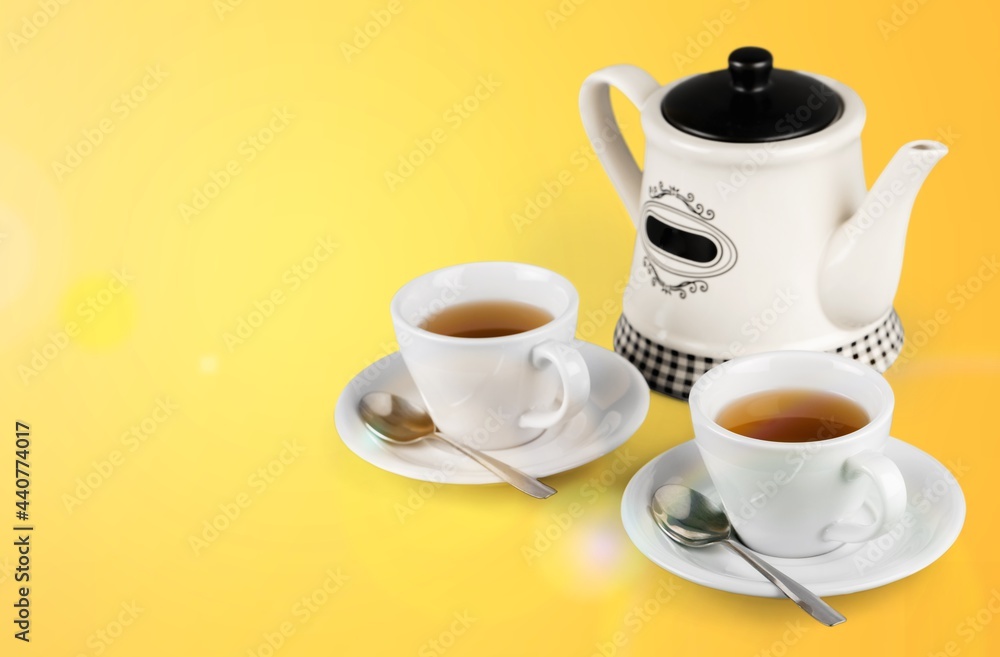 Poster herbal tea with white tea cups and teapot on a kitchen desk