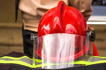 Firefighter uniform with red helmet. image of a red helmet of a fireman.