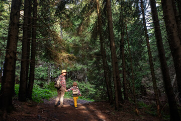 Happy family resting in the mountains in autumn