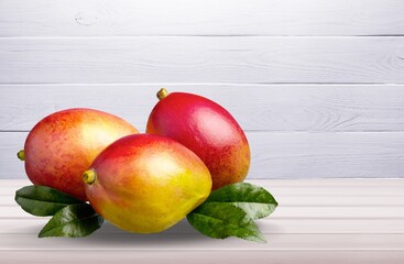 Tasty fresh mango fruit on the desk