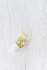 Jasmine fall into a cup. Herbal tea concept. Floral background