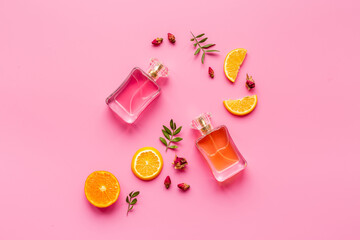 Perfume bottles with flowers leaves and fruits. Overhead view