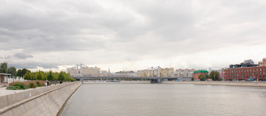 Crimean bridge. On the quays are moving pedestrians and cars